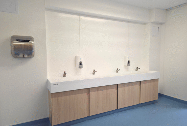 Automatic hand dryers, ceramic wash trough and push taps for sustainable washroom solution for primary school