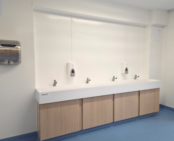 Automatic hand dryers, ceramic wash trough and push taps for sustainable washroom solution for primary school